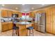Efficient kitchen with ample counter space, a kitchen island and modern stainless steel appliances at 5770 Waverley Ave, Firestone, CO 80504