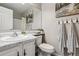 Cozy bathroom with marble counters, decorative towels, and neutral decor at 7468 S Alkire St # 204, Littleton, CO 80127