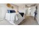 Comfortable bedroom with neutral walls, plush carpet and modern decor throughout at 7468 S Alkire St # 204, Littleton, CO 80127