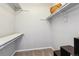 Walk-in closet with built-in shelving for efficient storage and organization at 7468 S Alkire St # 204, Littleton, CO 80127