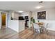 Charming dining area with a wooden table, seating for four, and stylish decor at 7468 S Alkire St # 204, Littleton, CO 80127