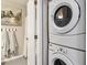 Convenient laundry room with stackable washer and dryer and ample space at 7468 S Alkire St # 204, Littleton, CO 80127