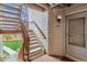 Exterior stairway leading to a condo unit with well-maintained stairs and outdoor lighting at 7468 S Alkire St # 204, Littleton, CO 80127