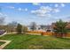 Scenic view of a lush green space with mature trees and meticulously maintained landscaping at 7468 S Alkire St # 204, Littleton, CO 80127