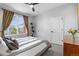 Well-lit bedroom featuring a large window, neutral tones, and ample closet space, promoting relaxation at 84 Spruce St # 707, Denver, CO 80230