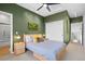 Stylish bedroom featuring unique moss art, a ceiling fan, and access to an ensuite bathroom at 84 Spruce St # 707, Denver, CO 80230