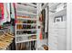 Organized walk-in closet featuring ample shelving, drawers, and hanging space for efficient storage at 84 Spruce St # 707, Denver, CO 80230
