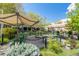 Outdoor community space offers picnic tables, shade structures, and landscaping at 84 Spruce St # 707, Denver, CO 80230