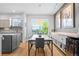 Bright dining area featuring modern décor and seamless kitchen access at 84 Spruce St # 707, Denver, CO 80230