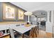 Bright dining room features a modern light fixture, sleek dining table, and access to a cozy living area at 84 Spruce St # 707, Denver, CO 80230