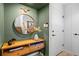 Stylish entryway featuring a round mirror, wooden console table with drawers, and neutral wall colors at 84 Spruce St # 707, Denver, CO 80230