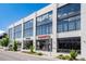 Commercial building with large windows, street parking and retail spaces at 84 Spruce St # 707, Denver, CO 80230