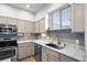 Modern kitchen featuring stainless steel appliances, sleek countertops, and ample lighting at 84 Spruce St # 707, Denver, CO 80230