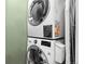 Space-saving stacked washer and dryer unit, perfect for efficient laundry management at 84 Spruce St # 707, Denver, CO 80230