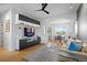 Cozy living room featuring modern furniture, a mounted television, and hardwood floors at 84 Spruce St # 707, Denver, CO 80230