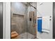 Contemporary walk-in shower featuring stylish tile, modern fixtures, and a convenient built-in niche at 84 Spruce St # 707, Denver, CO 80230