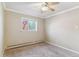 Inviting bedroom with a ceiling fan and a bright window allowing for natural light at 1330 Elizabeth St # 8, Denver, CO 80206