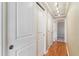 Hallway with hardwood floors, closet space, and neutral walls at 1330 Elizabeth St # 8, Denver, CO 80206