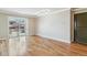 Bright living room with gleaming hardwood floors and sliding doors to the balcony at 1330 Elizabeth St # 8, Denver, CO 80206