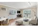Spacious living room featuring hardwood floors, balcony access, and a comfortable seating area at 1330 Elizabeth St # 8, Denver, CO 80206
