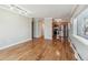 Open-concept living area featuring hardwood floors and a kitchen with stainless steel appliances at 1330 Elizabeth St # 8, Denver, CO 80206