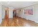 Living area featuring hardwood floors, bright light, and a kitchen with stainless steel appliances at 1330 Elizabeth St # 8, Denver, CO 80206