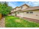 Well-maintained backyard with a stone wall and lush lawn at 2558 Premier Pl, Boulder, CO 80304