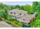 Expansive backyard with well-maintained lawn, mature trees, and a full fence providing privacy at 2558 Premier Pl, Boulder, CO 80304
