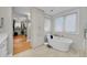 Bright bathroom with free-standing soaking tub, closet, and modern fixtures at 2558 Premier Pl, Boulder, CO 80304