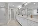 Large bathroom with double sink vanity, quartz countertop, modern mirrors and tiled shower at 2558 Premier Pl, Boulder, CO 80304