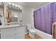 Bathroom featuring modern vanity, mirror, and shower/tub combination with colorful curtain at 2558 Premier Pl, Boulder, CO 80304