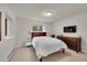 Bedroom with a double bed, dresser, television, carpet, and a small window at 2558 Premier Pl, Boulder, CO 80304