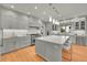 Bright kitchen with modern pendant lighting, an island with bar seating, and stainless steel appliances at 2558 Premier Pl, Boulder, CO 80304