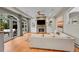 Bright living room featuring a stone fireplace, built-in shelves, modern decor, and glass doors to the outdoors at 2558 Premier Pl, Boulder, CO 80304