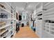 Spacious walk-in closet with custom shelving, drawers, and ample storage space at 2558 Premier Pl, Boulder, CO 80304