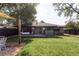 Expansive backyard featuring a large lawn and a covered patio area perfect for entertaining at 199 S Ivy St, Denver, CO 80224