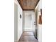 Inviting entryway features modern lighting, tiled floor, and convenient coat storage at 199 S Ivy St, Denver, CO 80224