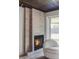 Cozy fireplace with tiled surround and comfortable seating area at 199 S Ivy St, Denver, CO 80224