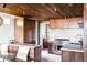 Modern kitchen with light floors, wood cabinets, stainless steel appliances and breakfast nook at 199 S Ivy St, Denver, CO 80224