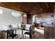 Modern kitchen with light floors, wood cabinets, stainless steel appliances and breakfast nook at 199 S Ivy St, Denver, CO 80224