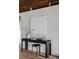 Well-appointed living area with a sleek desk and stool at 199 S Ivy St, Denver, CO 80224