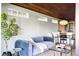 Cozy living room with stylish furniture, ample natural light, and views of the modern kitchen at 199 S Ivy St, Denver, CO 80224