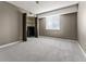 Bedroom with grey carpeting, closet, and window with blinds at 7335 E Quincy Ave # 303, Denver, CO 80237