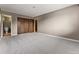 Spacious bedroom with carpeting, double door closet and access to bathroom at 7335 E Quincy Ave # 303, Denver, CO 80237