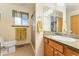 Bathroom featuring a single vanity sink, walk in shower, and tiled floors at 12906 Cherry Way, Thornton, CO 80241