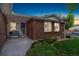 Inviting covered front porch with beautiful landscaping and curb appeal at 12906 Cherry Way, Thornton, CO 80241