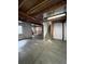 Unfinished basement with concrete floor and stairs at 1129 S Duquesne Cir, Aurora, CO 80018