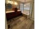 A bathroom with double sinks, a bathtub, wood accents, and sleek fixtures, creating a spa-like retreat at 1129 S Duquesne Cir, Aurora, CO 80018