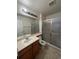 Bathroom with shower and single sink vanity at 1129 S Duquesne Cir, Aurora, CO 80018