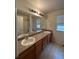 Bathroom with double sink vanity at 1129 S Duquesne Cir, Aurora, CO 80018